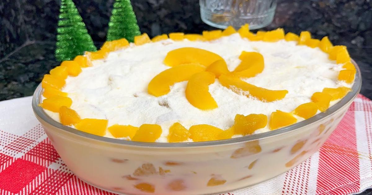 Pavê de pêssego com creme suave, bolacha e camadas deliciosas, perfeito para festas de fim...