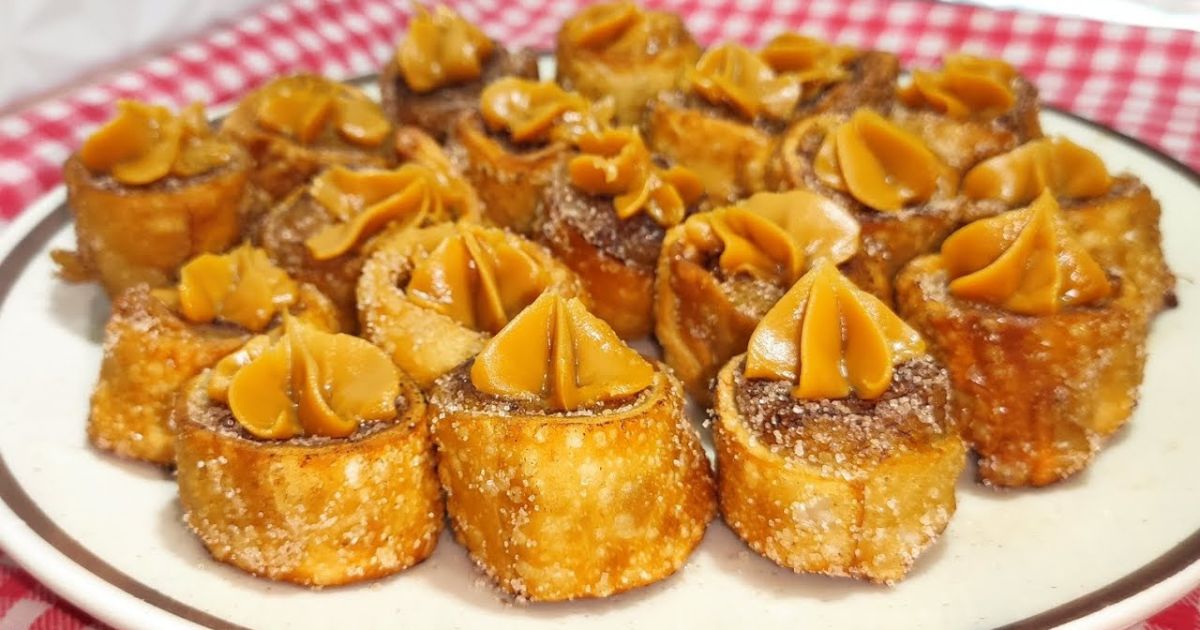 Enroladinho de banana com massa de pastel, doce de leite e canela: simples e irresistível....